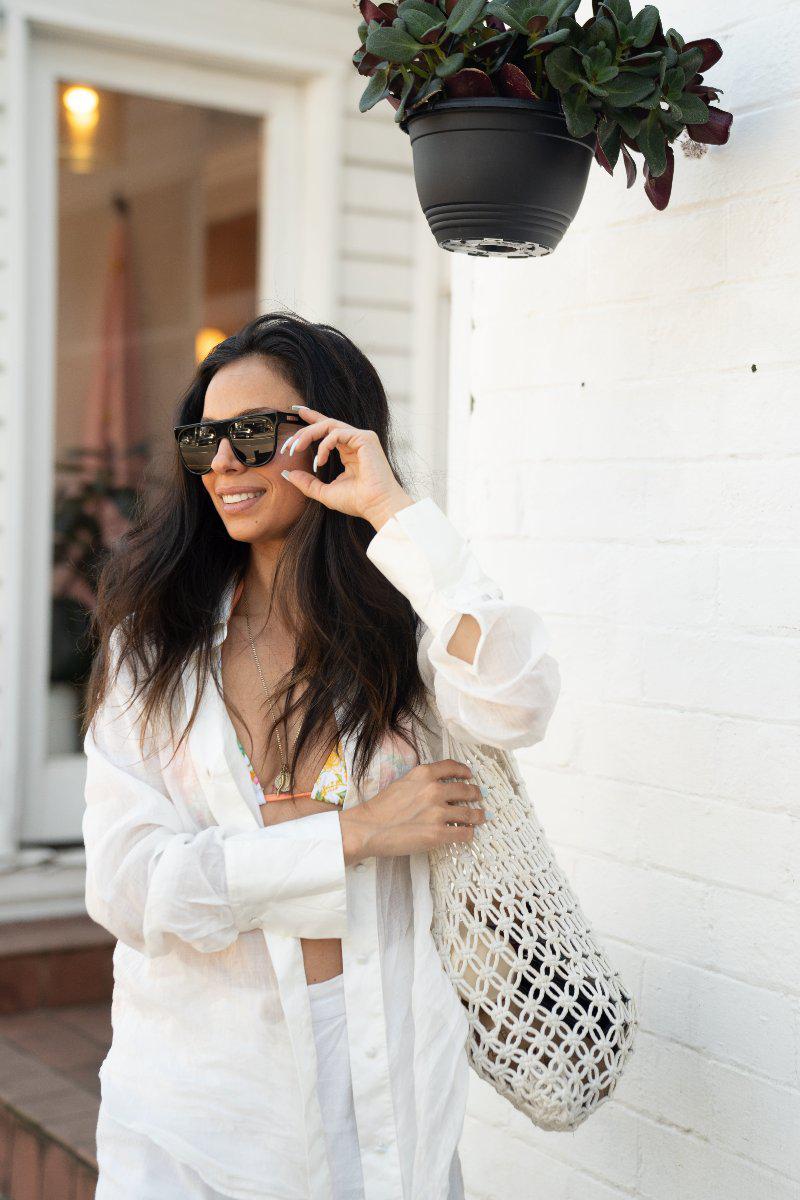 model wearing Orca Black sunglasses
