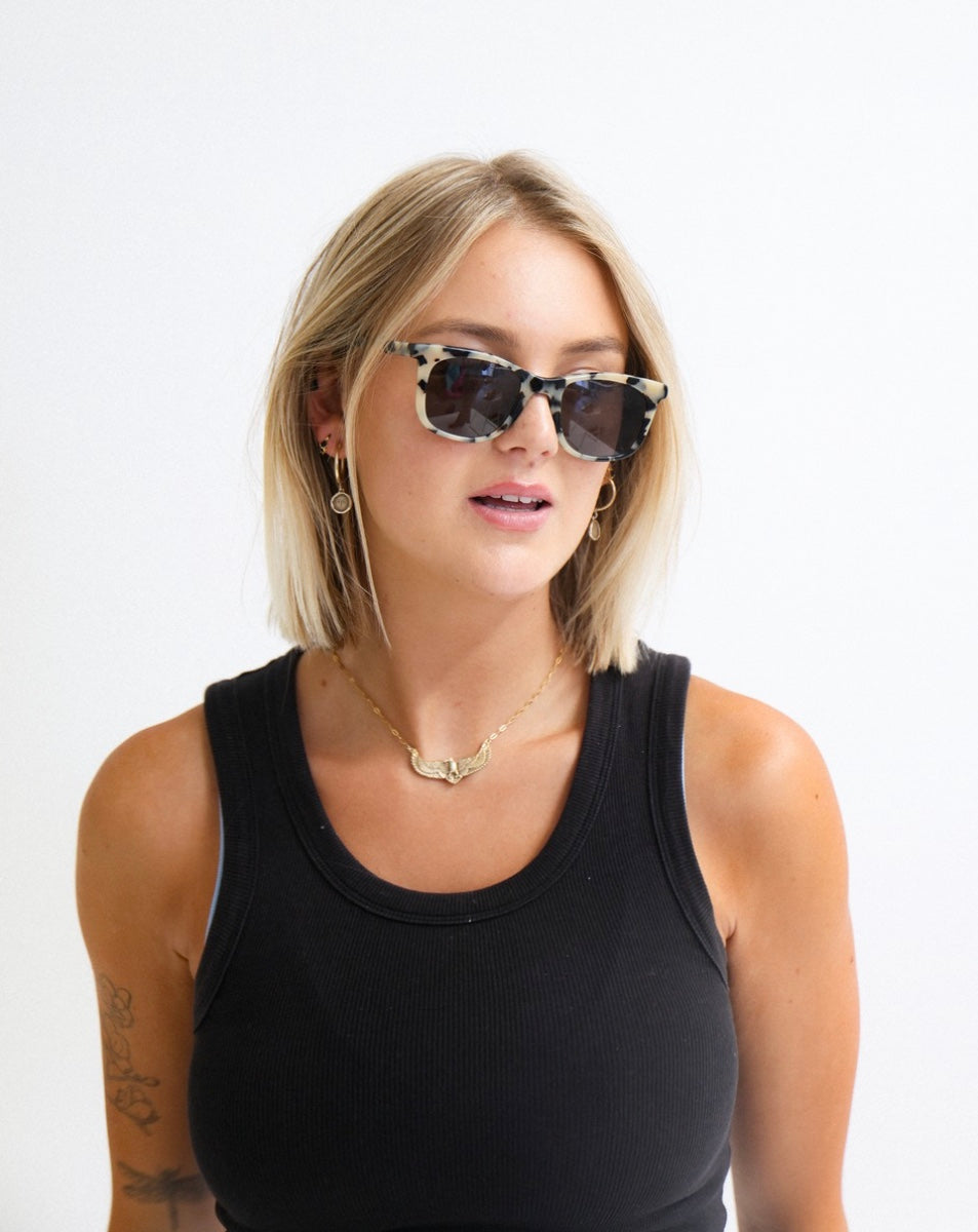 model wearing Tama Leopard Seal sunglasses