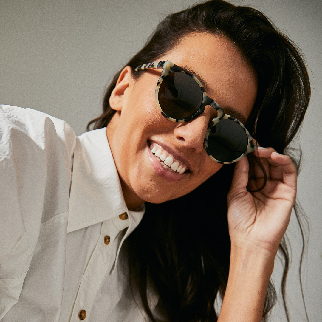 Female model wearing Wategos Leopard Seal sunglasses from Ozeano Vision