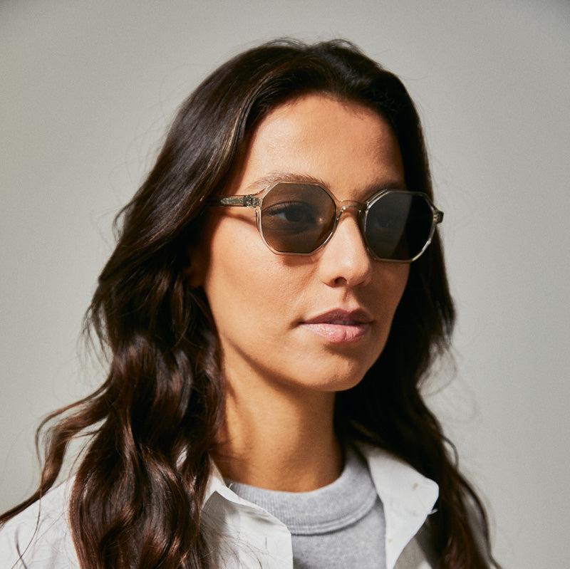 Female model wearing green Coolum turtle sunglasses from Ozeano