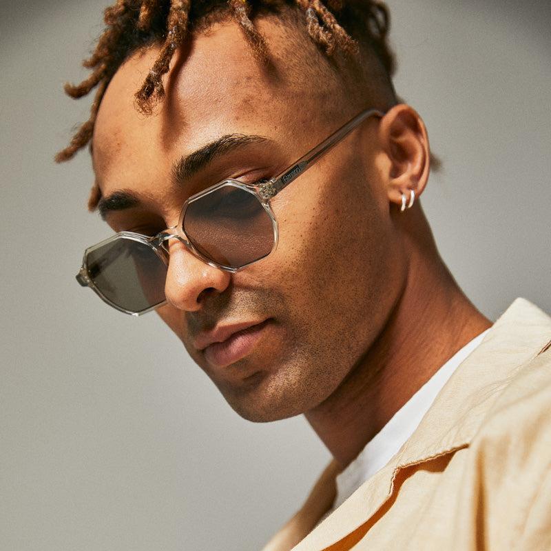 Male model wearing green polarised sunglasses from Ozeano Coolum Turtle Polarised Sunglasses by Ozeano