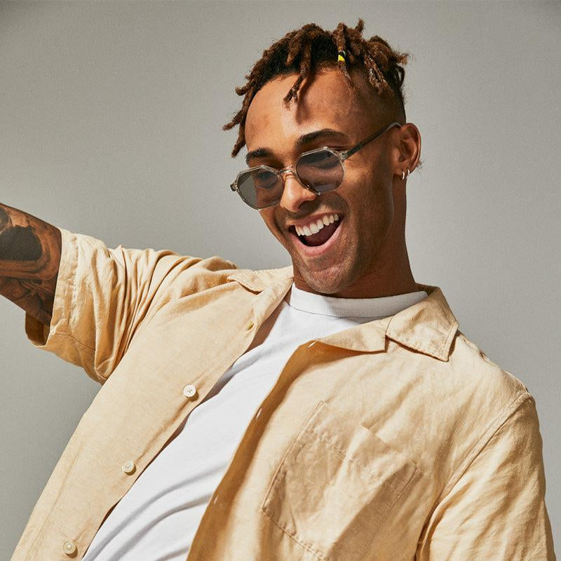 Male model wearing green polarised sunglasses from Ozeano Vision