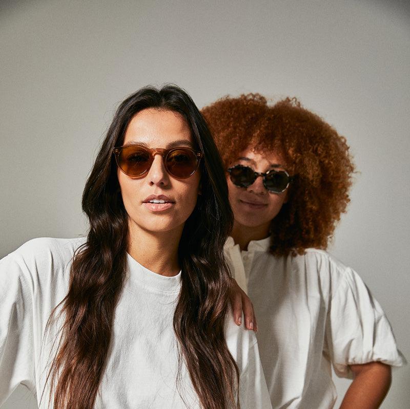 Female models wearing brown polarised sunglasses
