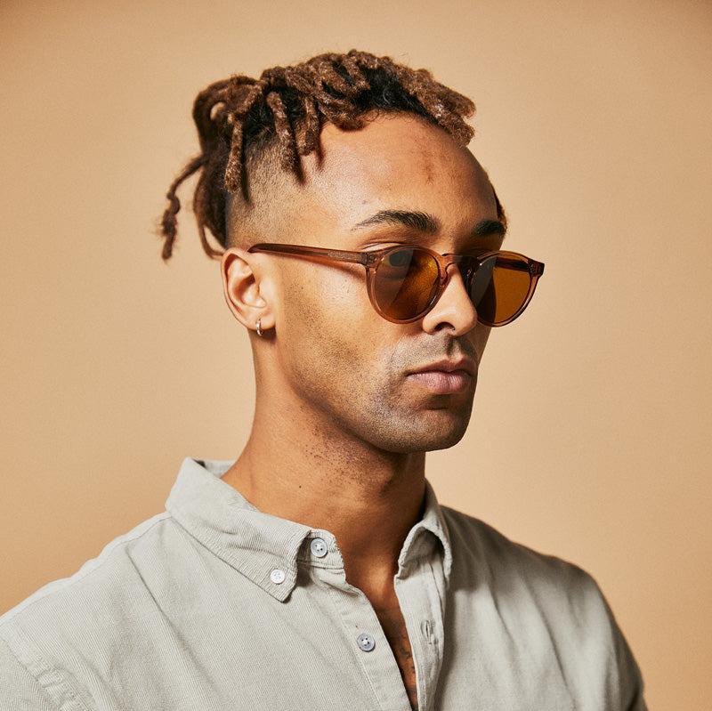 Male model wearing plant based polarised sunglasses