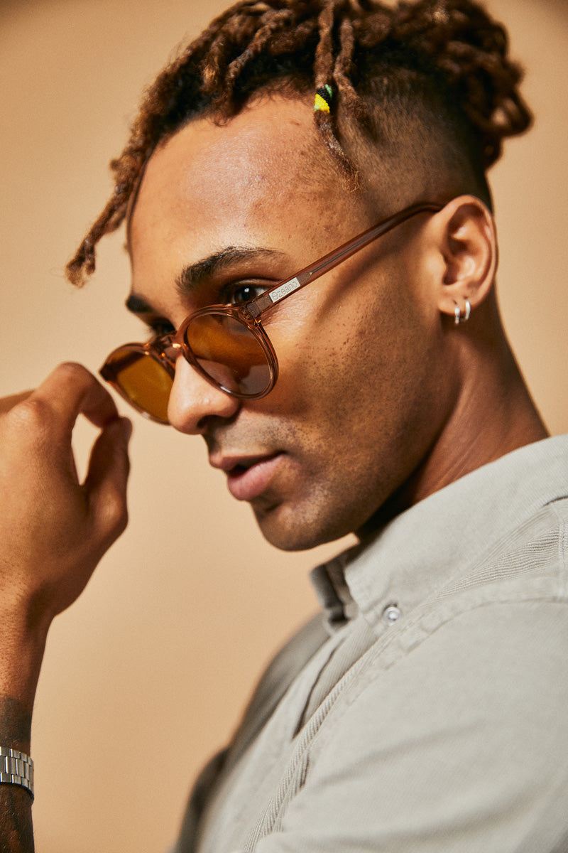 Male model wearing striking colour prescription sunglasses