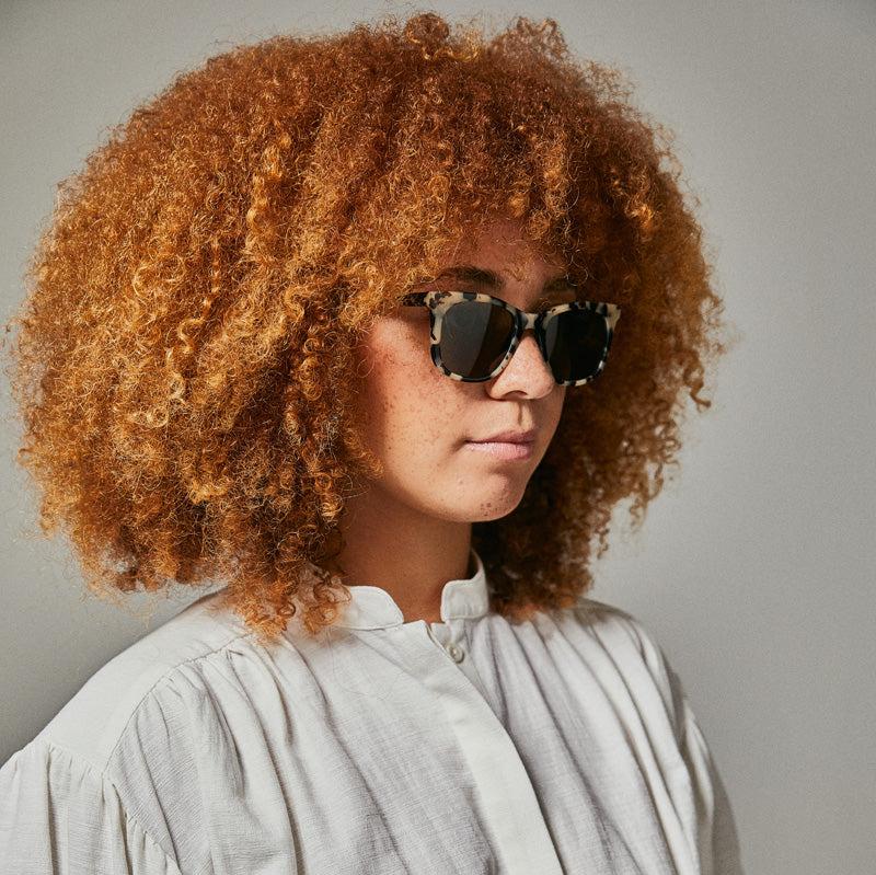 Female model wearing Tama leopardseal polarised sunglasses