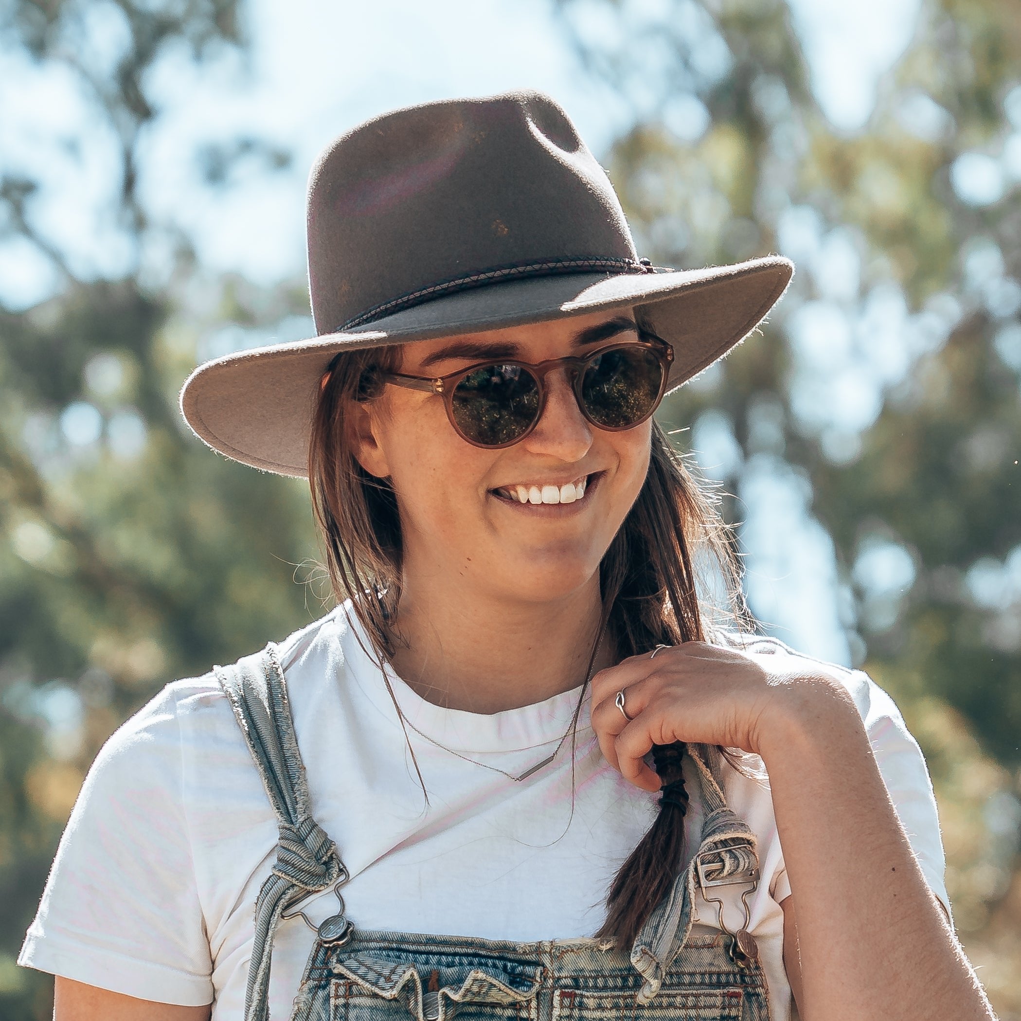 Model wearing brown polarised sunglasses