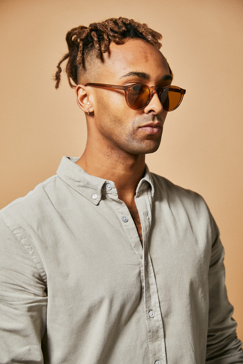 Male model wearing brown prescription sunglasses